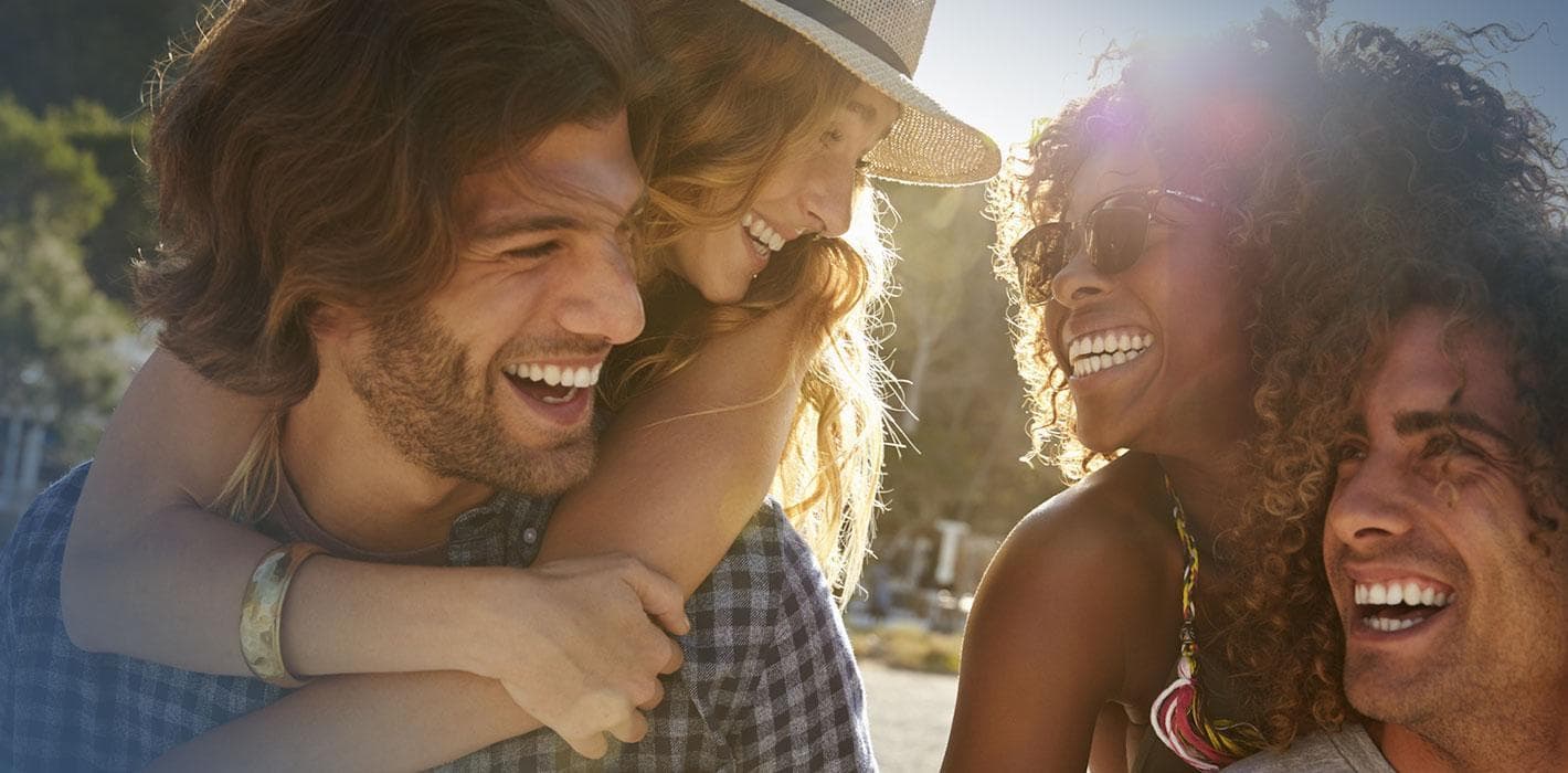 A group of friends laughing together outdoors