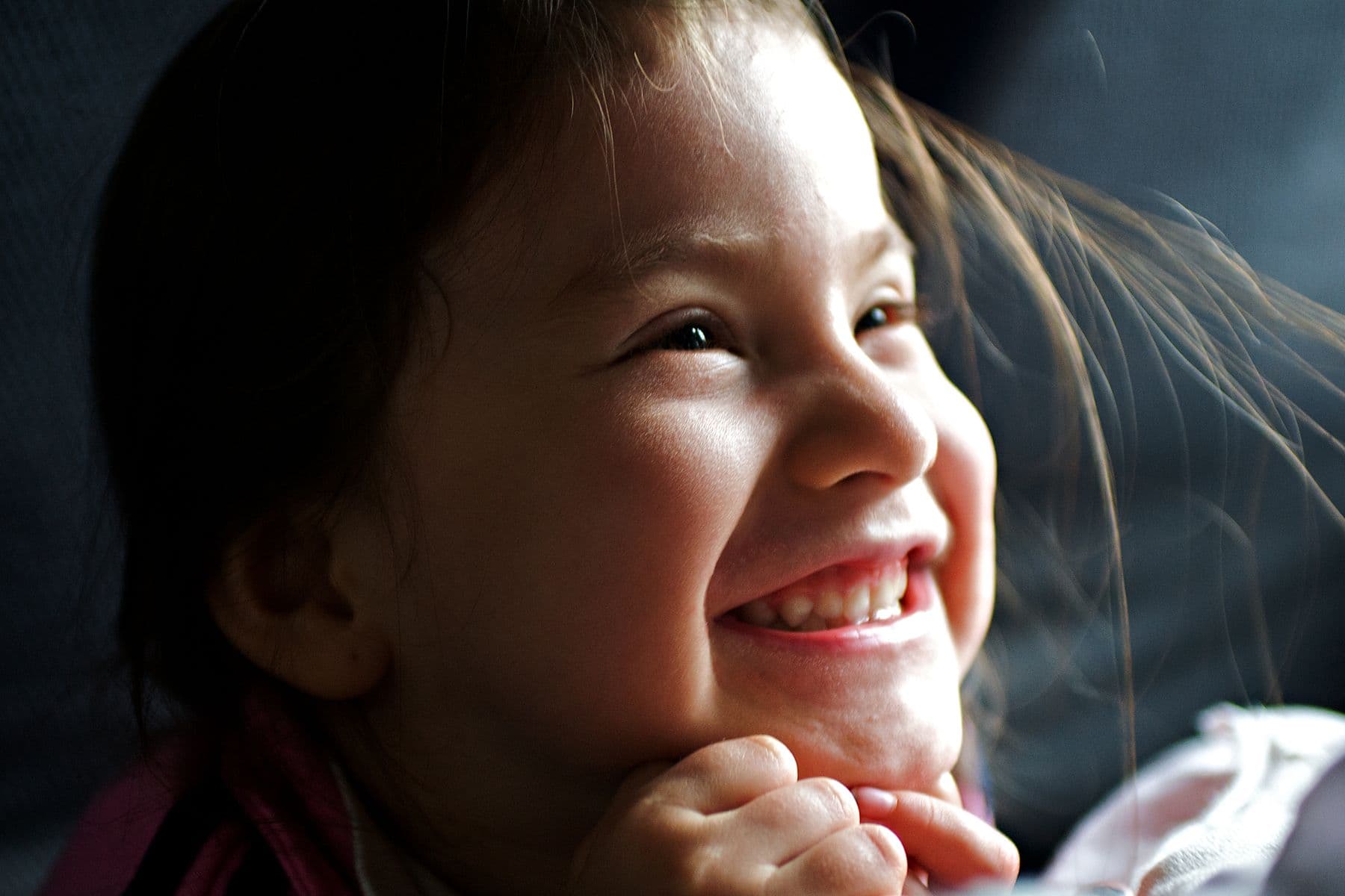 A young girl smiling